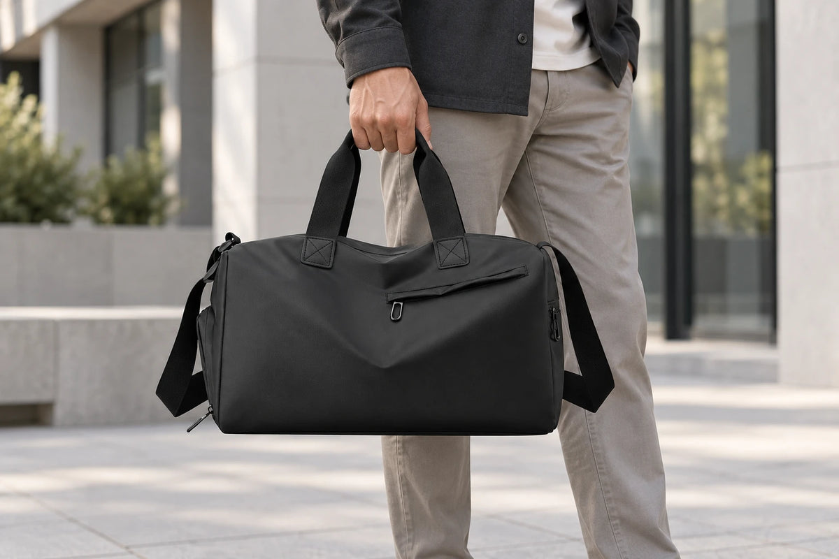 Black Everyday Gym Bag carried by its handles